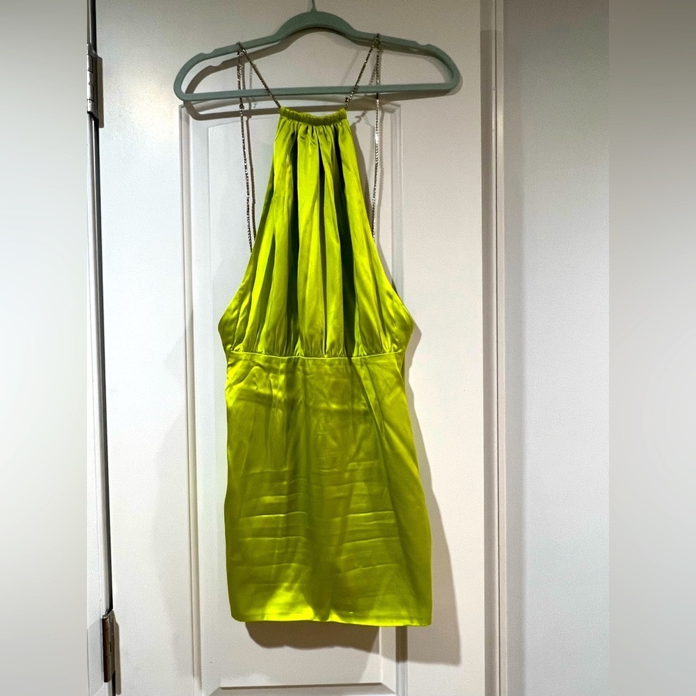 Retrofet. Green open back dress with a chain